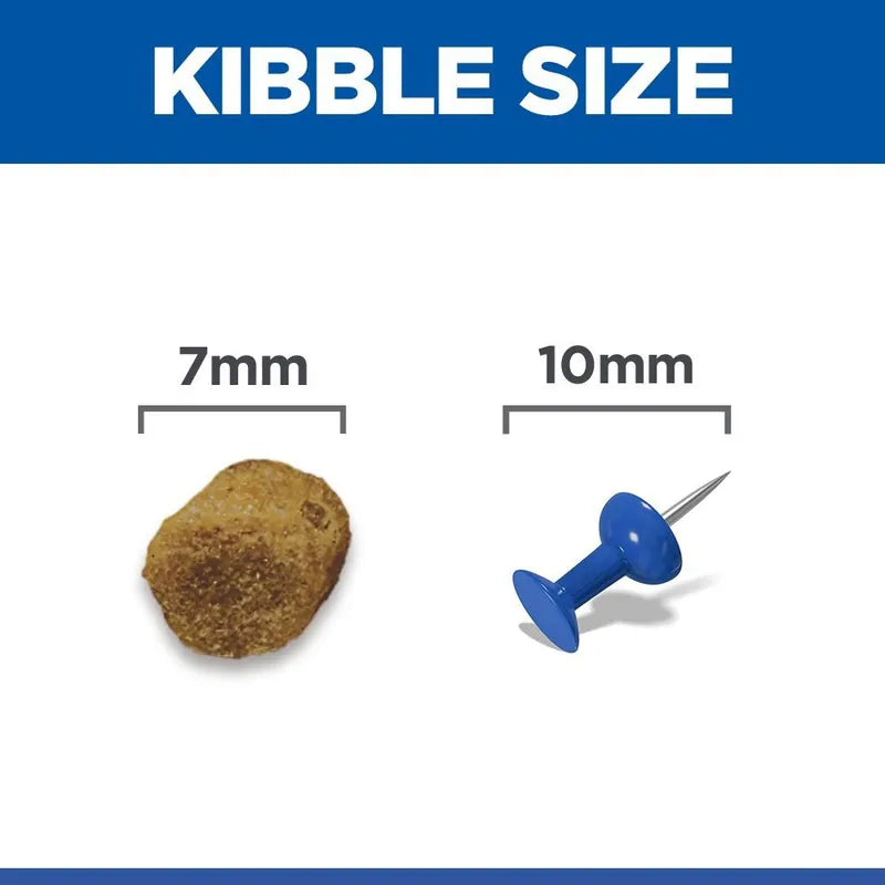 Comparison of kibble size to a 7mm and 10mm pin on a white background with blue border.
