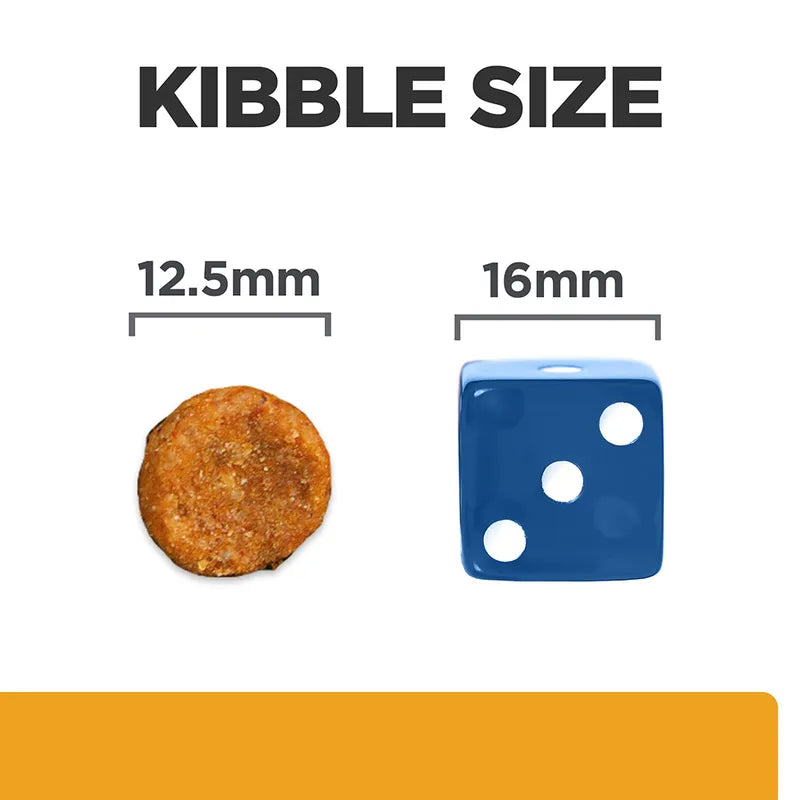 Comparison of kibble size with a 12.5mm diameter round object and a 16mm blue die.