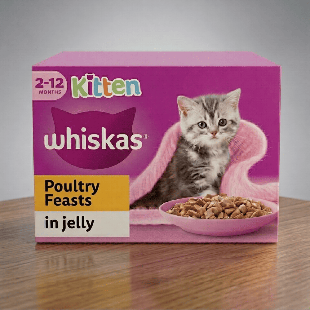 Whiskas Kitten Poultry Feasts in Jelly food packaging on a wooden surface