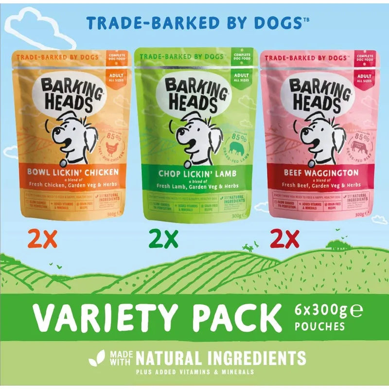 Three packages of Barking Heads dog food with a variety pack label on a green landscape background.