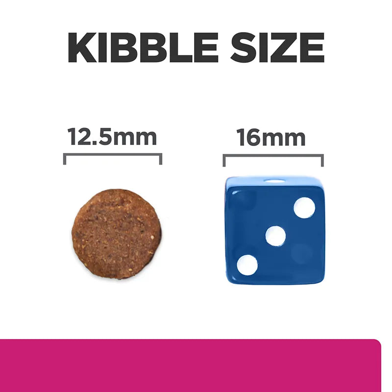 Comparison of kibble size to a blue die with measurements on a white background