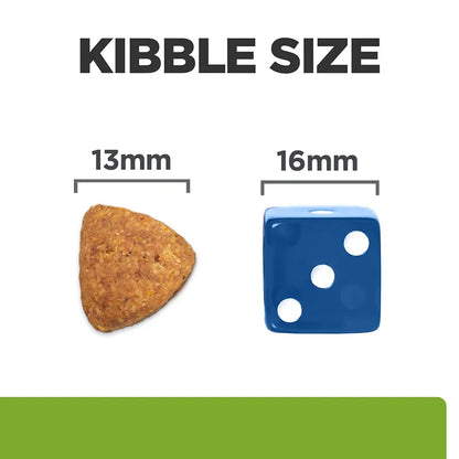Comparison of kibble size to a blue die showing 13mm and 16mm dimensions.