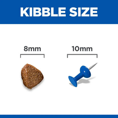 Comparison of kibble size to an 8mm and 10mm pin on a blue and white background.