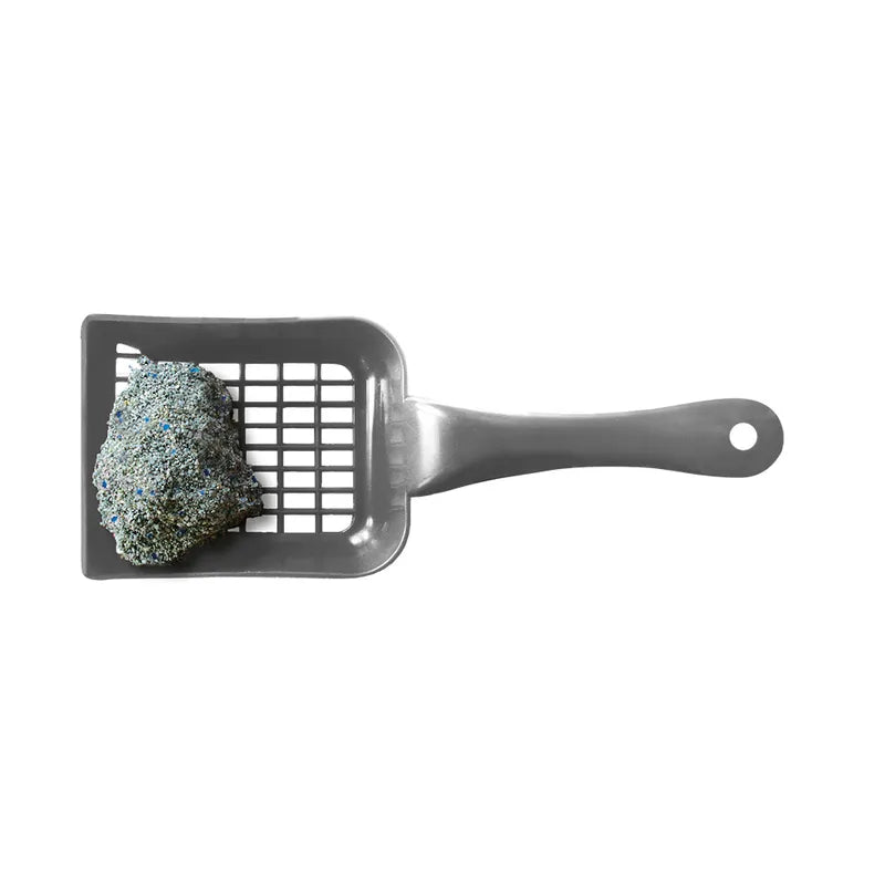 Gray pet scoop with a clump of cat litter on a white background